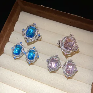 Detailed view of vintage palace style jewelry with blue and pink square zircons