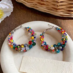 Handmade colorful beaded hoop earrings with irregular glass beads in a vibrant dopamine style.