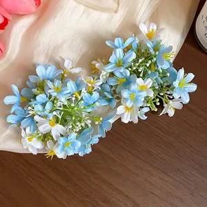 Elegant blue and white fabric flower duckbill hair clips for a fresh spring look