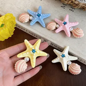 Set of starfish and shell hair clips with pearls, perfect for seaside beach vacations.