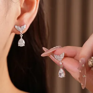 Elegant mermaid tail teardrop earrings with zircon inlay in silver finish.