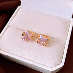Elegant pink star-shaped zirconia hoop earrings displayed in a luxury white gift box