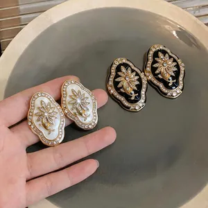 Elegant vintage palace style floral stud earrings with sparkling crystals for women