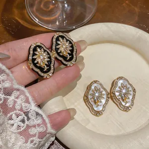 Elegant vintage palace style gold plated flower earrings with sparkling crystals for women