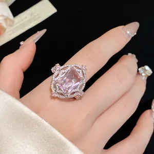Detailed macro shot of a vintage pink zircon ring featuring an intricate halo setting