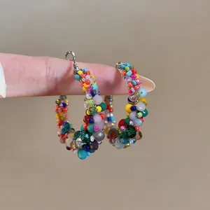 Detailed macro view of colorful beaded hoop earrings with vibrant glass seed beads