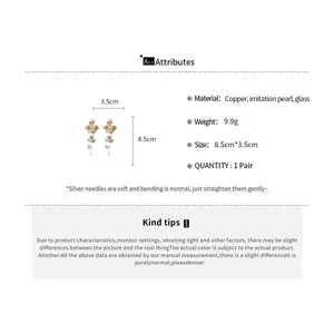 Floral tassel earrings with pearl detail and dimensions shown on attribute card