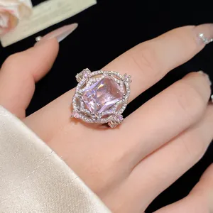 Macro detail shot of a vintage court style ring with a large pink rectangular zircon gemstone