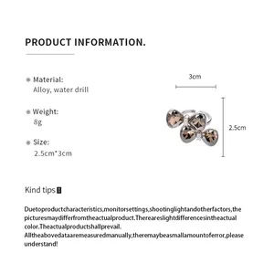 Detail view of rhinestone bow open ring with size and material specifications