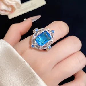 Detailed macro view of vintage palace style open ring featuring a brilliant blue square zircon