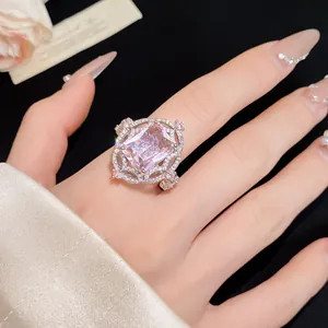 Close-up detail of a vintage palace style ring with a large pink rectangular zircon
