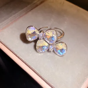 Close-up of elegant double bow adjustable ring with shimmering faceted crystals