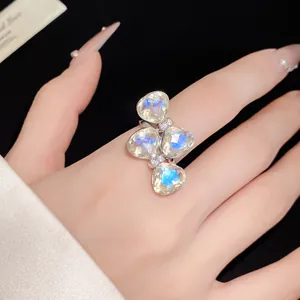 Detailed close-up of a sparkling rhinestone bow-knot open ring with faceted gems