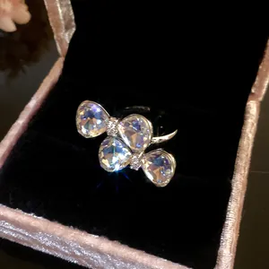 Close-up of elegant butterfly ring with iridescent crystals in velvet box