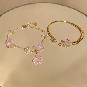 Elegant gold-plated butterfly bracelet and bangle set with sparkling zircons and pink accents
