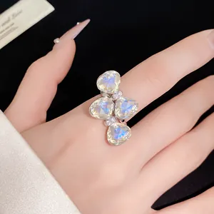 Detailed view of an elegant silver bow ring featuring iridescent butterfly stones