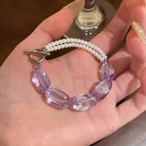 Elegante bracciale con cristalli viola e perle bianche, chiusura a levetta OT argento