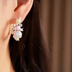 Elegant silver needle pearl hoop earrings with colorful beads and sparkling rhinestones.