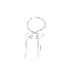 Double-layer pearl necklace with pink ribbon bow and floral charms on white background