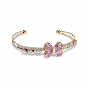 Elegant rose gold butterfly cuff bracelet with pink zircons and pearls for women.