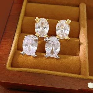 Elegante, 18 Karat vergoldete ovale Zirkon-Ohrringe in einer luxuriösen Holzbox
