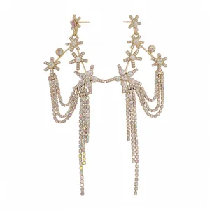 Elegant star-shaped rhinestone fringe earrings in gold-tone with colorful pastel gems