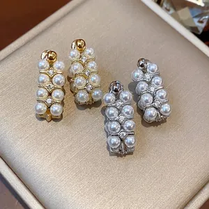 Elegant French vintage pearl stud earrings with zircon stones in gold and silver finish