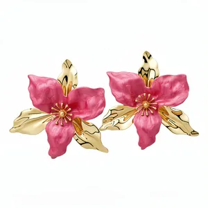 Elegant vintage-style pink enamel flower earrings with polished gold finish petals
