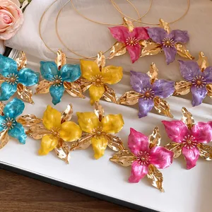 Detailed view of vintage enamel flower jewelry set in various vibrant vibrant colors
