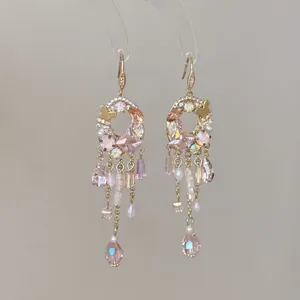 Elegant pink crystal butterfly tassel drop earrings with silver needles in ethnic luxury style