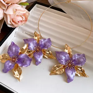 Detailed view of vintage purple enamel flower earrings and gold choker jewelry set