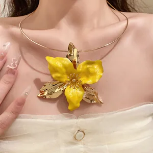 Close-up of vintage yellow enamel flower choker with gold-tone accents on a model