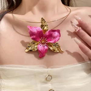 Detailed close-up of a vintage pink enamel flower choker necklace on a female model