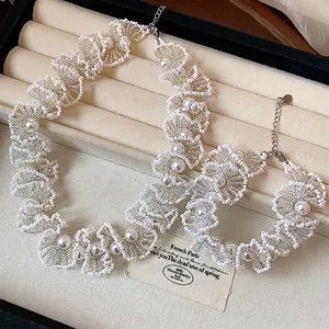 Elegant white glass bead lace necklace and bracelet set with delicate pearls