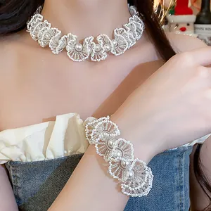 Detailed view of handmade pearl bead lace necklace and matching bracelet set