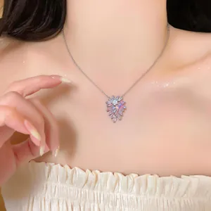 Detailed view of an elegant silver necklace featuring a sparkling pink zircon flower pendant