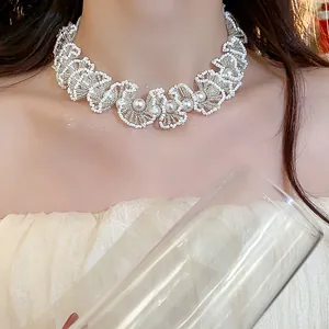 Close-up of white glass beaded lace choker necklace with elegant pearl floral details