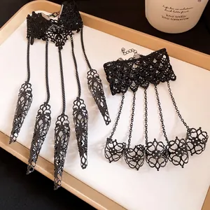 Detail of gothic black lace integrated ring bracelet with hollow floral metal claws