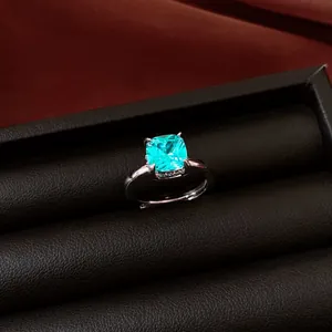 Detailed view of an elegant cushion-cut aqua zircon ring set in a premium black display