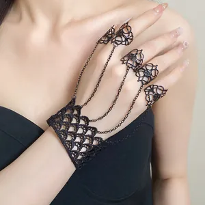 Detailed view of a black lace hollow integrated ring bracelet in a gothic retro dark style