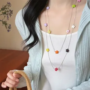 Stylish multi-layered necklace featuring colorful resin flower beads for summer vacation