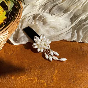 Detailed macro view of elegant French flower hair clip with white pearls and black velvet