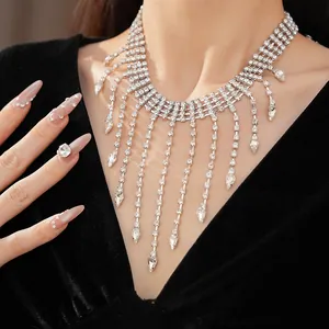 Detailed macro view of a sparkling rhinestone fringe necklace featuring elegant waterdrop pendants