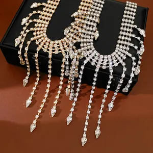 Macro detail of rhinestone tassels and water-drop pendants on luxurious necklaces