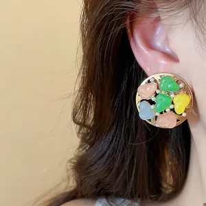 Detailed view of fresh summer round stud earring with colorful resin and pearls