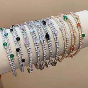 Detailed view of elegant 18k gold plated tennis bracelets with multi-color zircon stones.