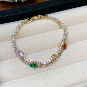 Close-up of 18k gold plated bracelet featuring colorful marquise stones and sparkling zircons
