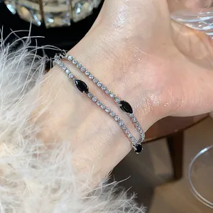Close-up of double-layer bracelet with black marquise stones and clear zircons on wrist