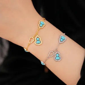 Elegant 18K gold and silver plated gourd bracelets with turquoise stones on a model's wrist