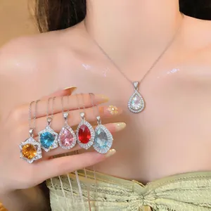 Detail showing vintage palace style zircon teardrop necklaces in various vibrant colors
